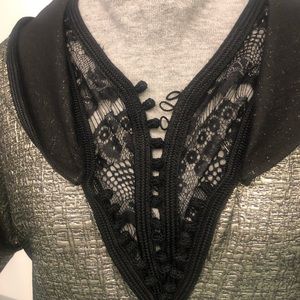 Jalaba with golden fabric, hand made, chest coved with black lace.